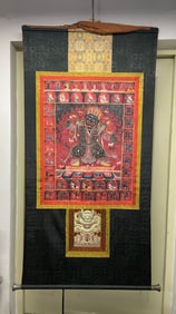 A piece of Qing Dynasty Tibetan Buddhism two-armed black robe holding a drum to protect Pharaoh