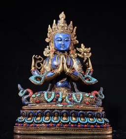 A piece of lapis lazuli four-armed Guanyin bronze gilt filigree inlaid with gemstones