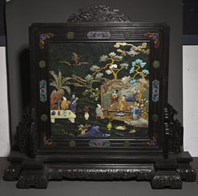 A piece of wood carving with floral motif inlaid with a treasure interstitial