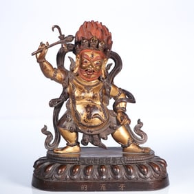 A bronze gilt statue of the Dharma Protector