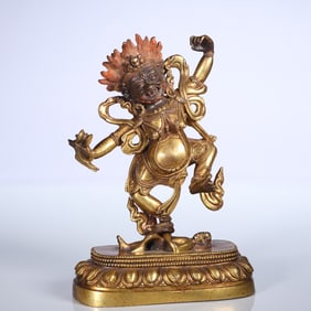 A bronze gilt statue of the Dharma Protector