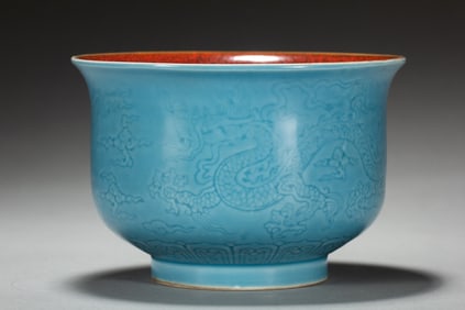 A blue glazed engraved dragon mug