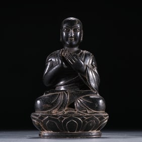 A Qing Dynasty black stone carving of the Guru Buddha