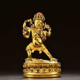 A Tibetan bronze gilt four-armed demon vajra hand ornament