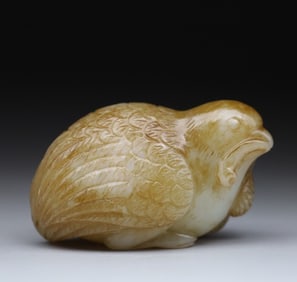 A piece of quail with ears of wheat