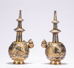 A pair of gilt water purification bottles