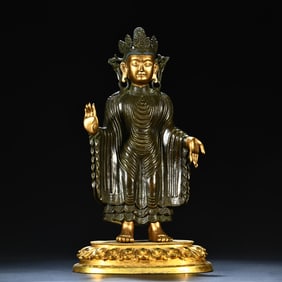 A bronze gilt cheongsam Buddha ornament