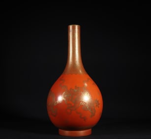 A piece of Qing Dynasty Qianlong coral red glaze depicted gold lion play ball gall bottle