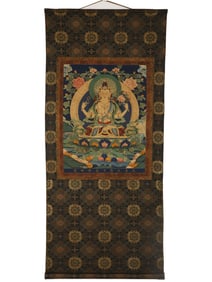 A silk four-armed statue of Guanyin