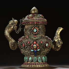 A Tibetan silver filigree inlaid with gemstones and dragon pattern holding pot
