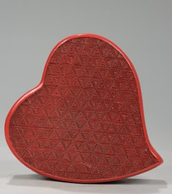 A peach-shaped incense box in the red Xuwei Hall