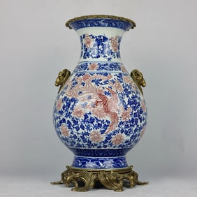 A blue and white glaze red phoenix pattern inlaid with copper sheep's head amphora jade pot spring