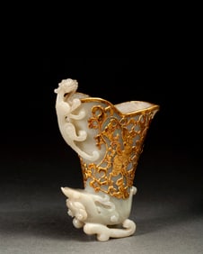 A piece of Qing Dynasty gold inlaid jade dragon cup