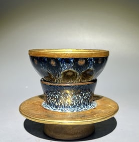 A silver-gilt trimmed building lamp