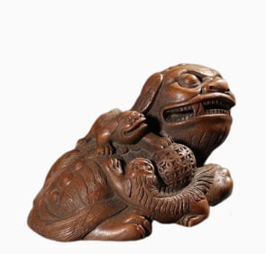 A piece of Qing bamboo carved lion play ball ornament