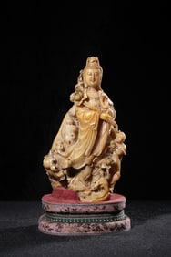 A piece of Qing Shou Mountain stone carving holding lotus Guanyin boy standing statue ornament