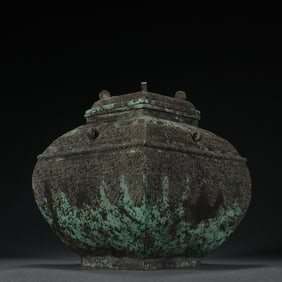 A bronze square lid jar