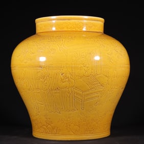 A Ming Dynasty Jiajing chicken glaze yellow carved figure jar