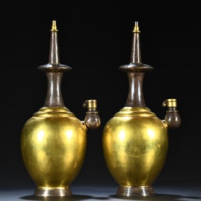 A pair of Tang sterling silver gilt net bottles
