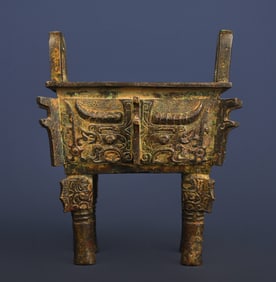 A piece of Western Zhou bronze beast face square ding