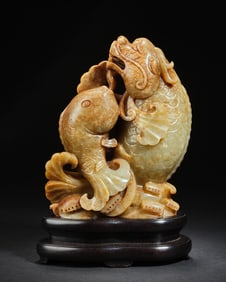 A Qing Dynasty fish-turned dragon and Tian jade ornament