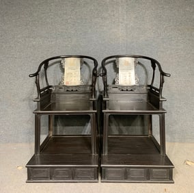 A pair of sandalwood rosewood sedan chairs