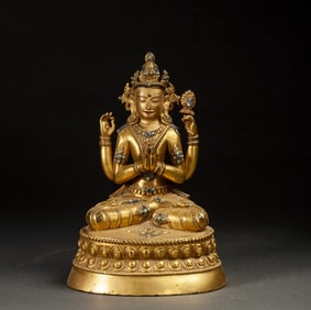 A Qing Dynasty four-armed statue of Guanyin