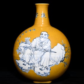 A piece of bright yellow glazed blue and white arhat pattern flat bottle