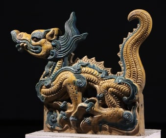 A piece of dragon-shaped building element glazed