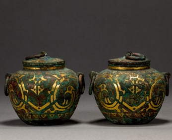 A pair of bronze misplaced gold pots