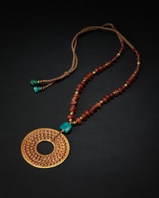 An ancient gold necklace with ancient beads