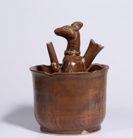 A set of purple figurines and wine jugs