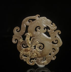 A piece of Hetian jade hollow dragon pendant