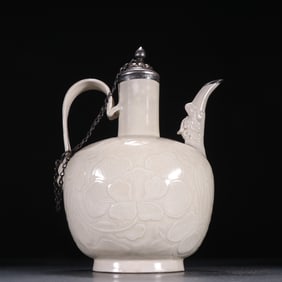 A piece of white porcelain carved pot in the kiln