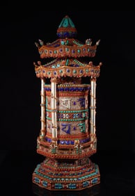 A piece of Tibetan silver filigree inlaid with gemstones