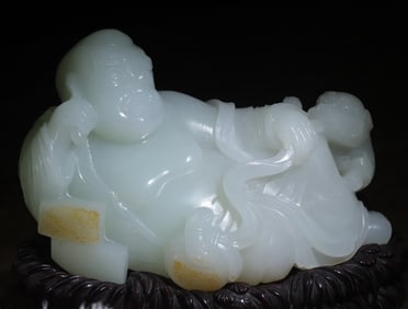 A white jade ear-digging Arhat ornament