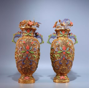 A pair of bronze gilt filigree burnt blue twig lotus pattern vases