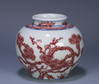 A piece of Qing Yongzheng official kiln blue and white glaze red pine, bamboo and plum small jar