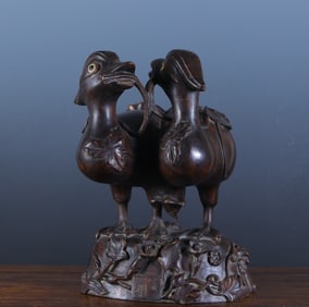 An agarwood quail ornament