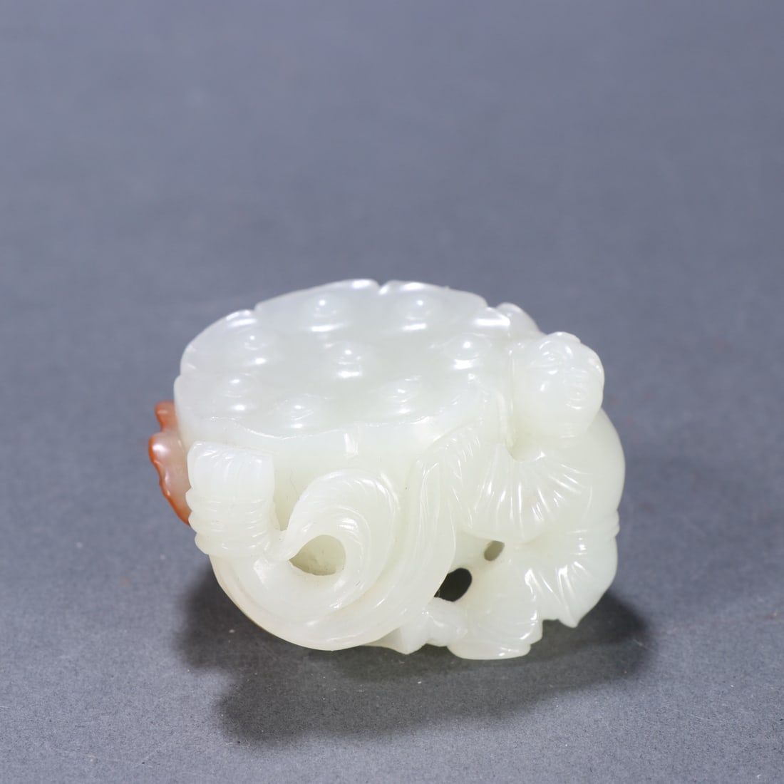 A Qing Dynasty Hetian jade seed material lotus sheng guizi carving (1 of 9)