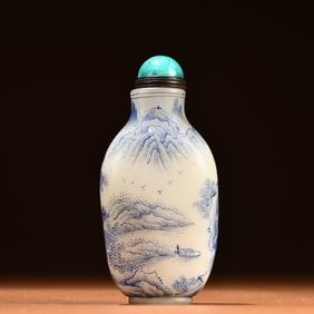 A snuff bottle with an enamel painting enamel landscape figure