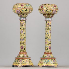 A pair of jars with enamel gilt lids