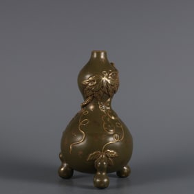 A  piece of Qianlong in the Qing Dynasty tea glaze depiction gold carving Fulu pattern three-legged