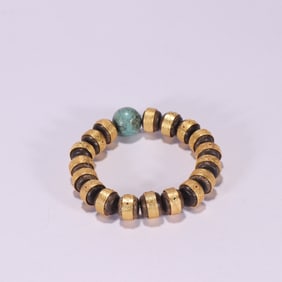 A clear agarwood inlaid silver gilt bracelet