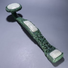 A piece of Qing Dynasty jasper carved landscape figures inlaid with white jade Ruyi