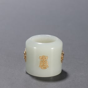 A piece of Qing Dynasty Hetian jade inlaid with silver gilt longevity pattern wrench