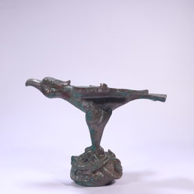 A bronze turquoise ornament