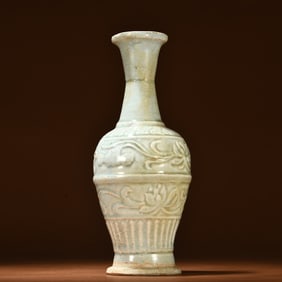 A piece of celadon carved lotus pattern vase