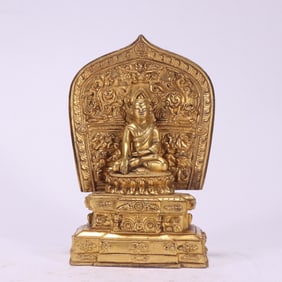 A Qing Dynasty gilt Guru Buddha statue