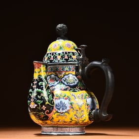 A piece of painted enamel teapot ornament
